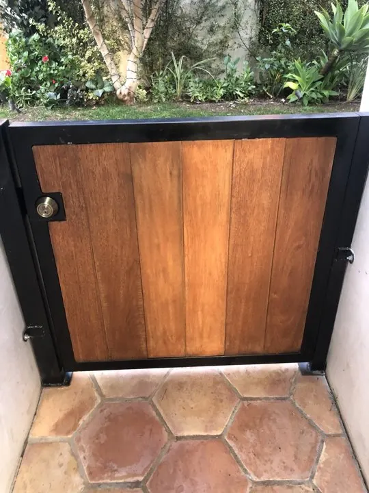 Compact timber gate at the garden path