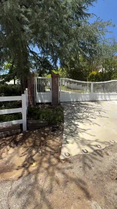 Film still: Driveway gates closed