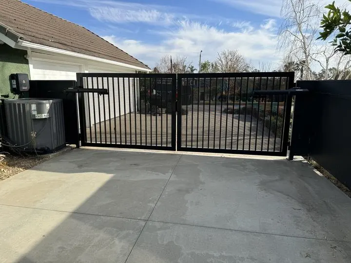 Open-picket double driveway gate
