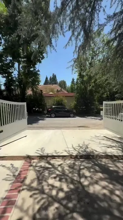 Film still: Driveway gates open